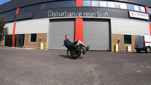 Discrete Reference Tracking Control to Swing-Up an Electric Wheelchair